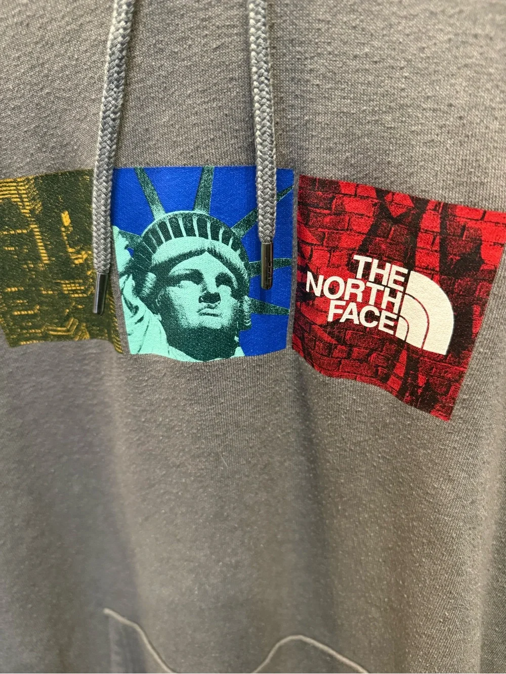 The North Face Men's Gray Pullover Hoodie with Graphic Logo